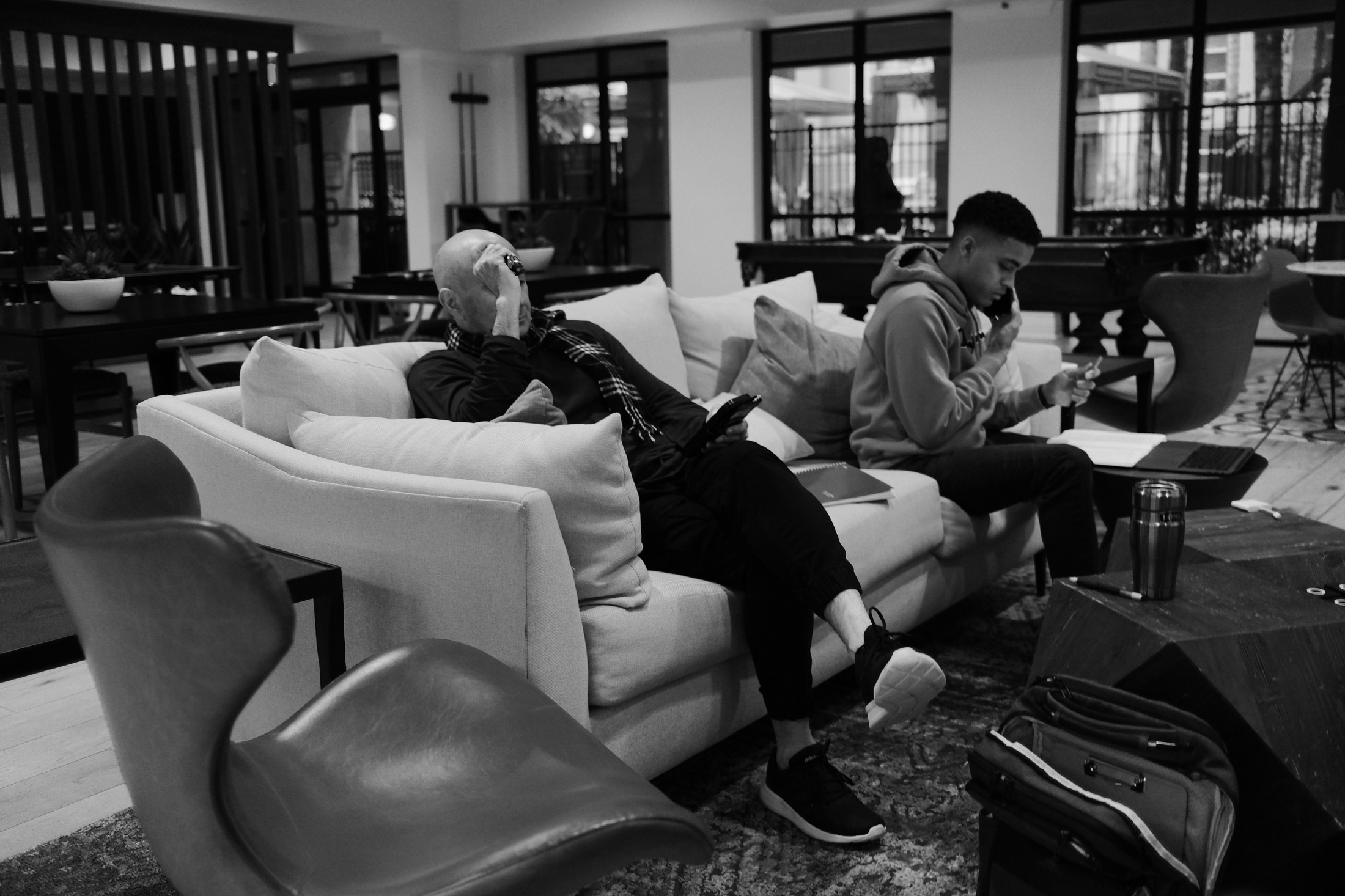 Two production team members reviewing notes between takes